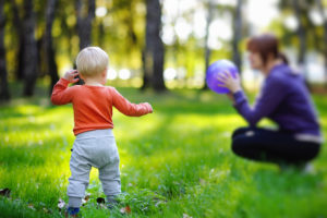 Babysitting, childcare and nanny service by MyHotelSitter - photo of child playing catch outside
